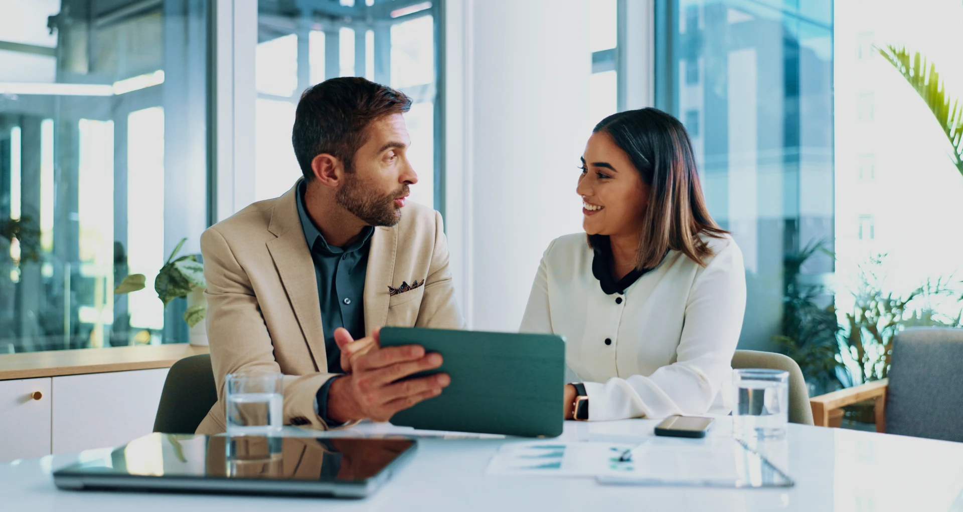 Business meeting with tablet discussion